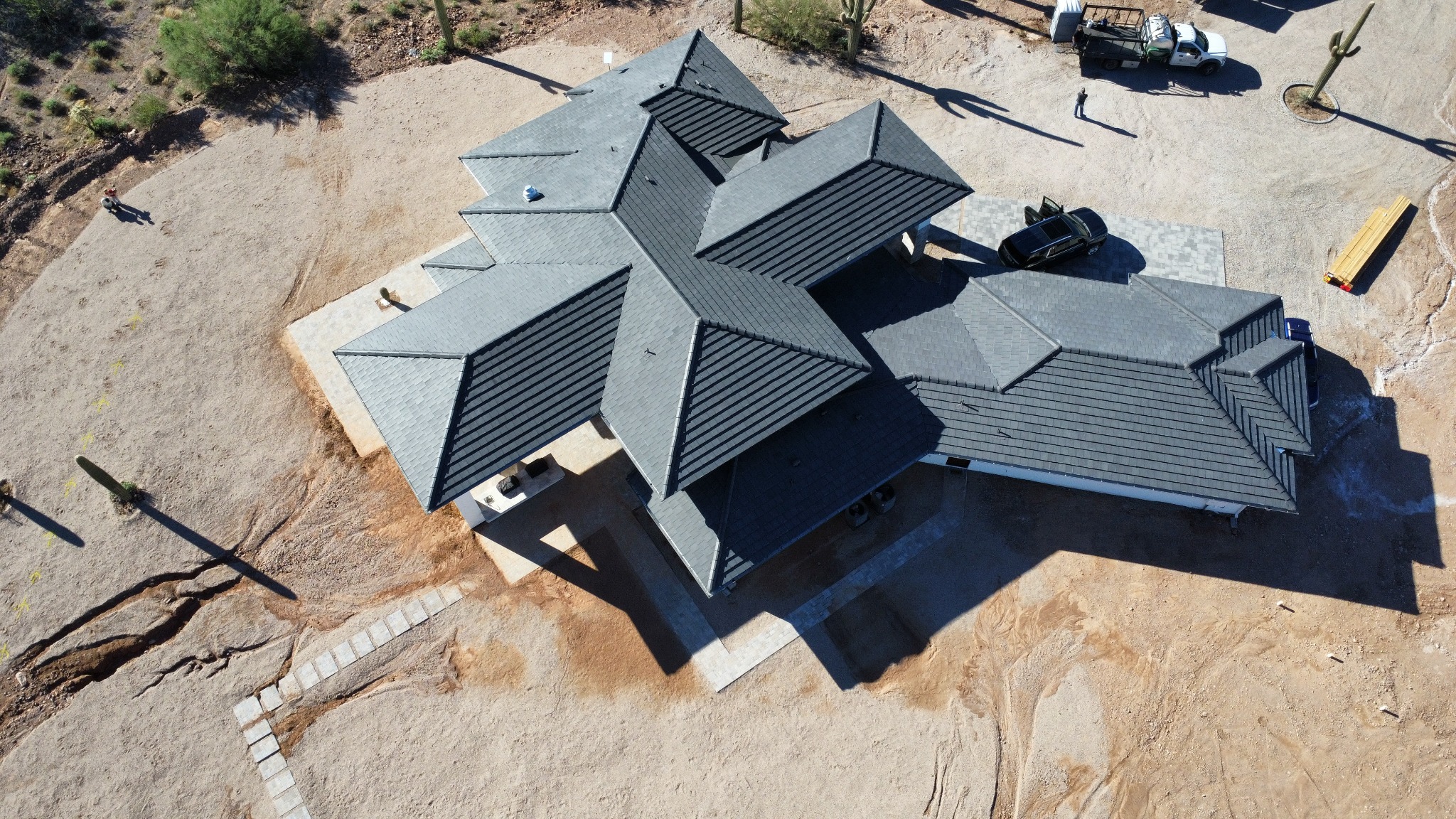 Custom Scottsdale Arizona home with shingle and standing seam metal roofing